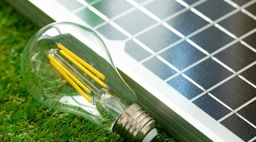 Solar energy panel and light bulb, green energy